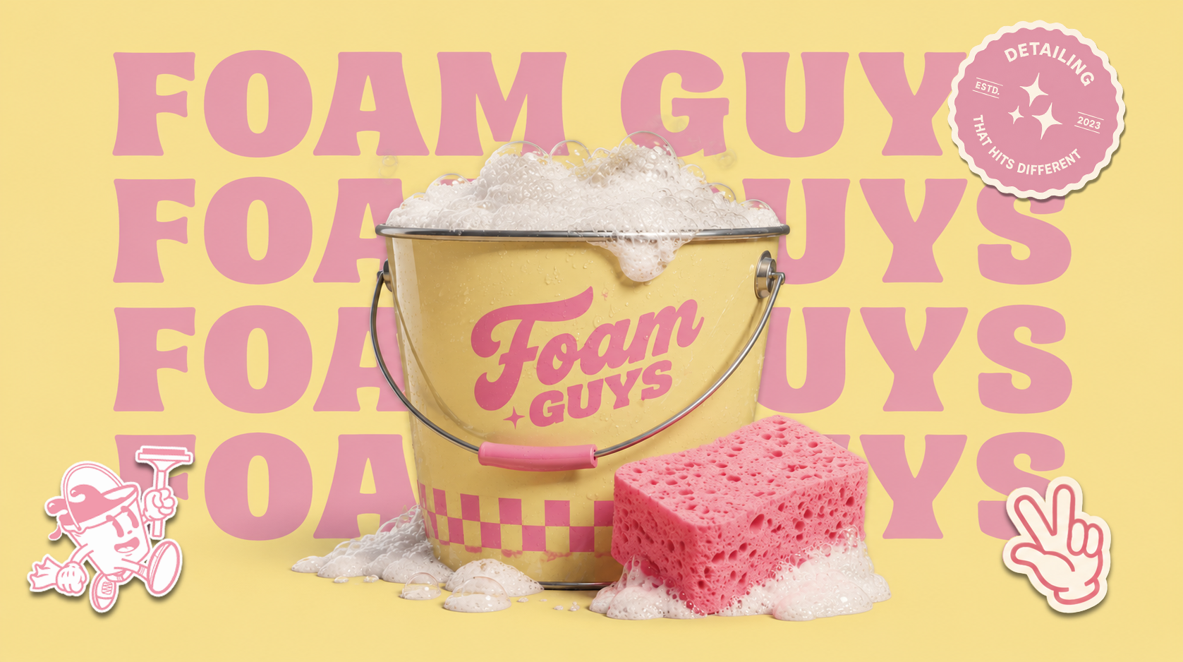 Foam Guys yellow detailing bucket filled with foam beside a pink sponge